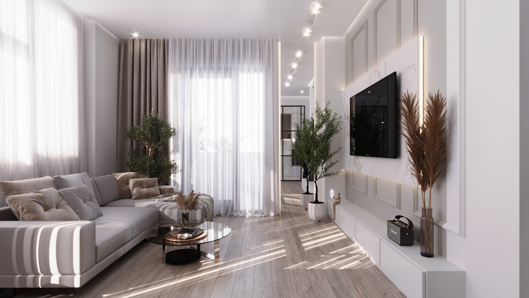 A professionally staged, bright and airy luxury living room with modern furniture, showcasing the quality of full-service home marketing.